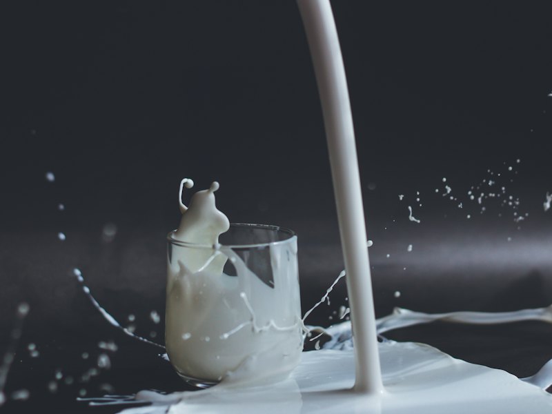 White candle in clear glass holder